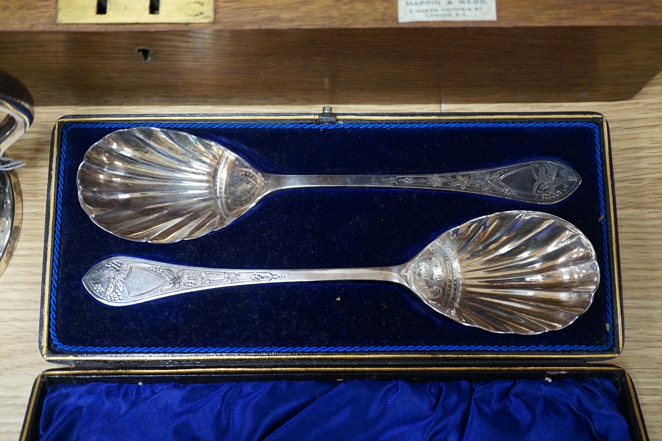 A Mappin & Webb canteen plated cutlery with ivorine inset, cased pair plated servers spoons and plated pint mug